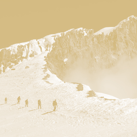Hikers walking up the mountain through snow