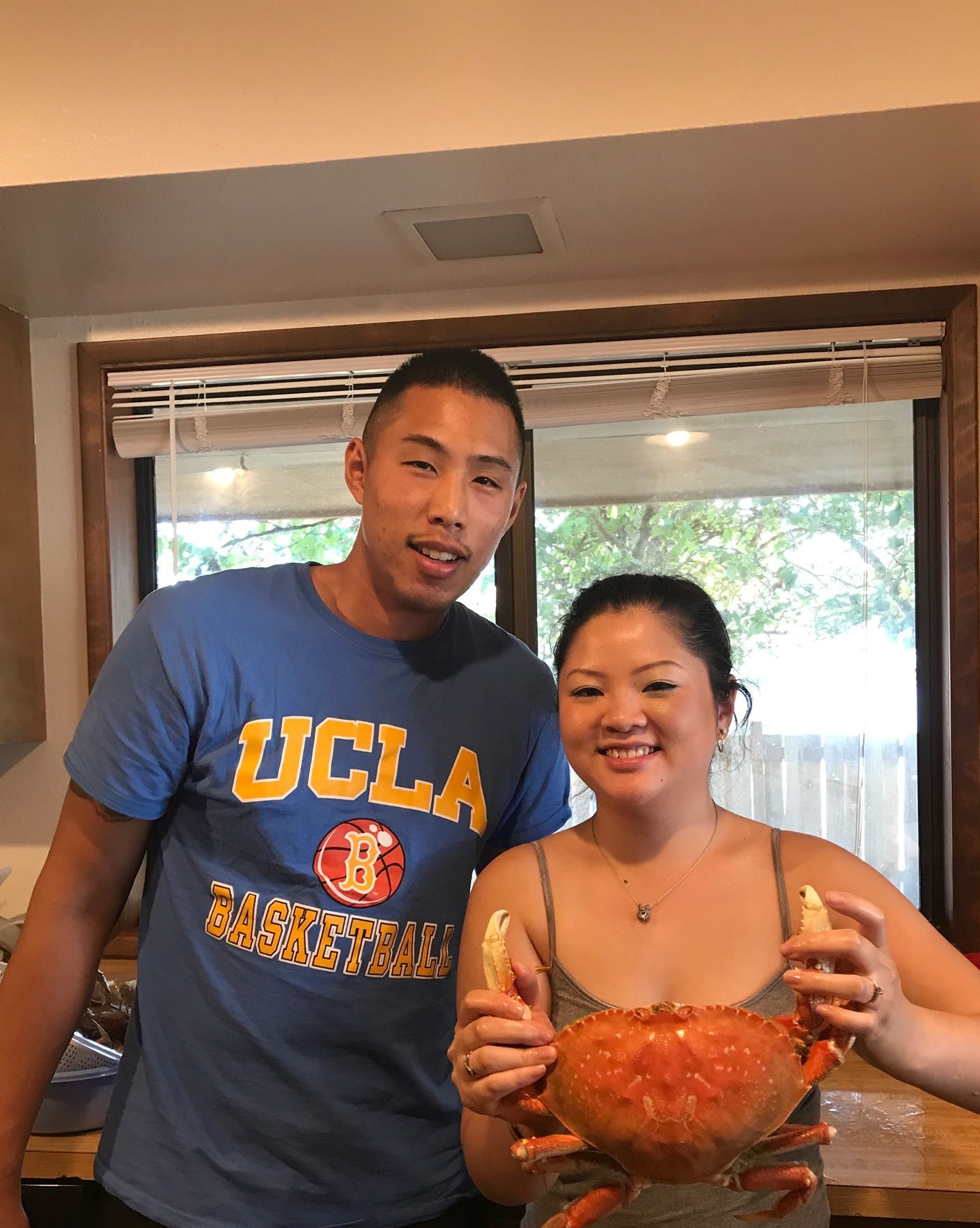 Austen and his girlfriend, holding dinner (crabs!)