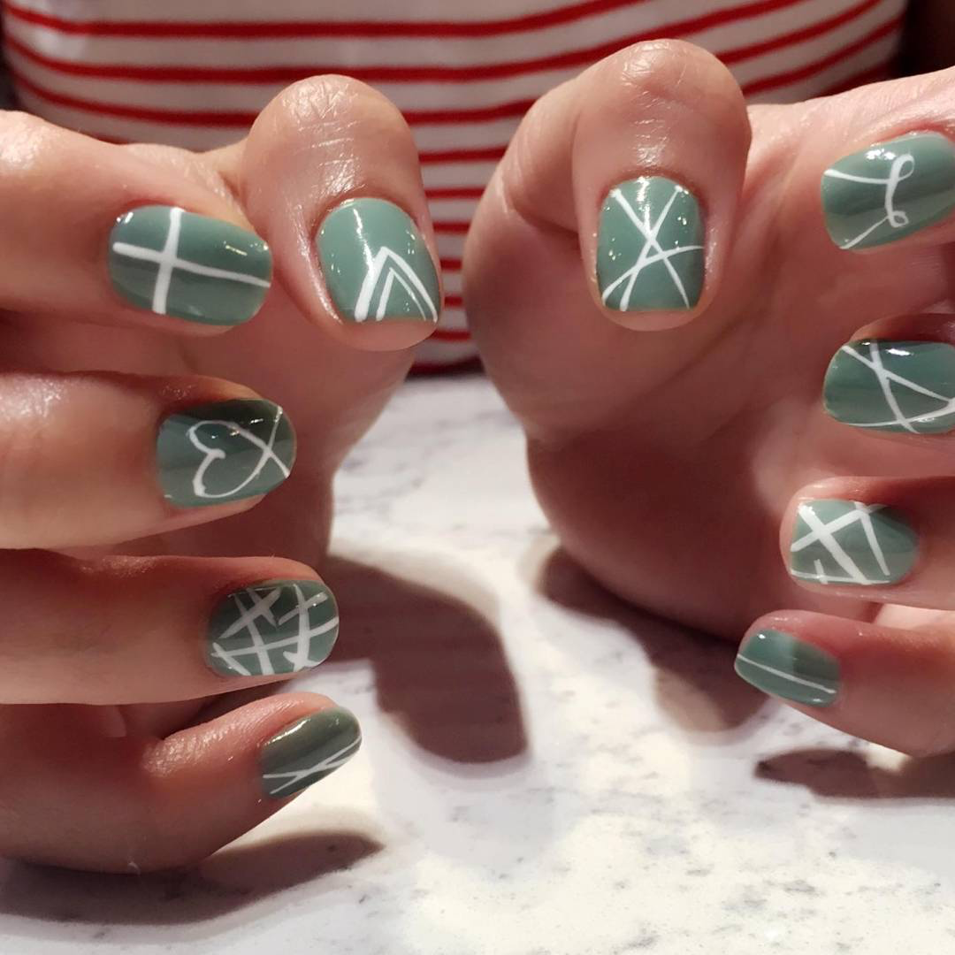 Sage green with white accent nails