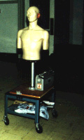 dummy with wheeled car and recording equipment