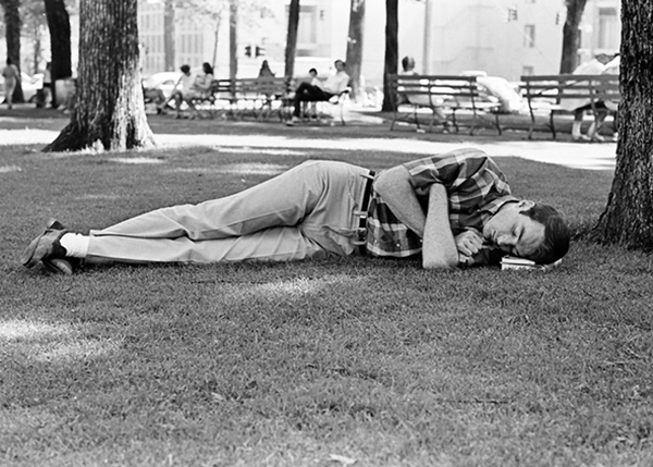 Man sleeping on park grass, 1968